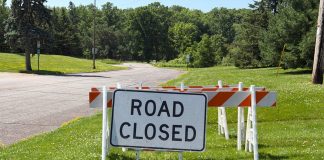 Marshfield Woman in Critical Condition, Owen Man Dead After Apparent Domestic Shooting road closed sign